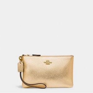 Metálica Gold Coach Wristlet in excellent condition 👝